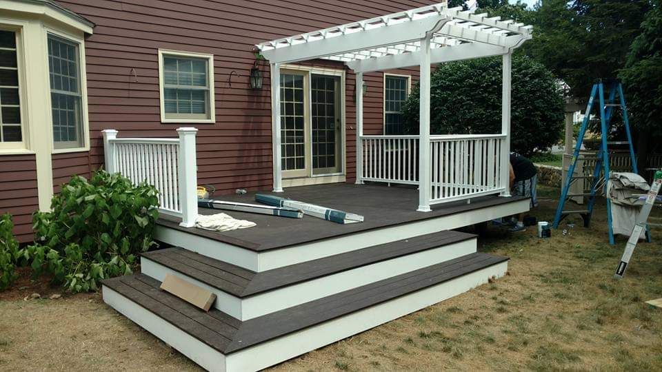 After — composite deck with white pergola and stairs by Prairie Building Sutton, MA After — composite deck with white pergola and stairs by Prairie Building Sutton, MA