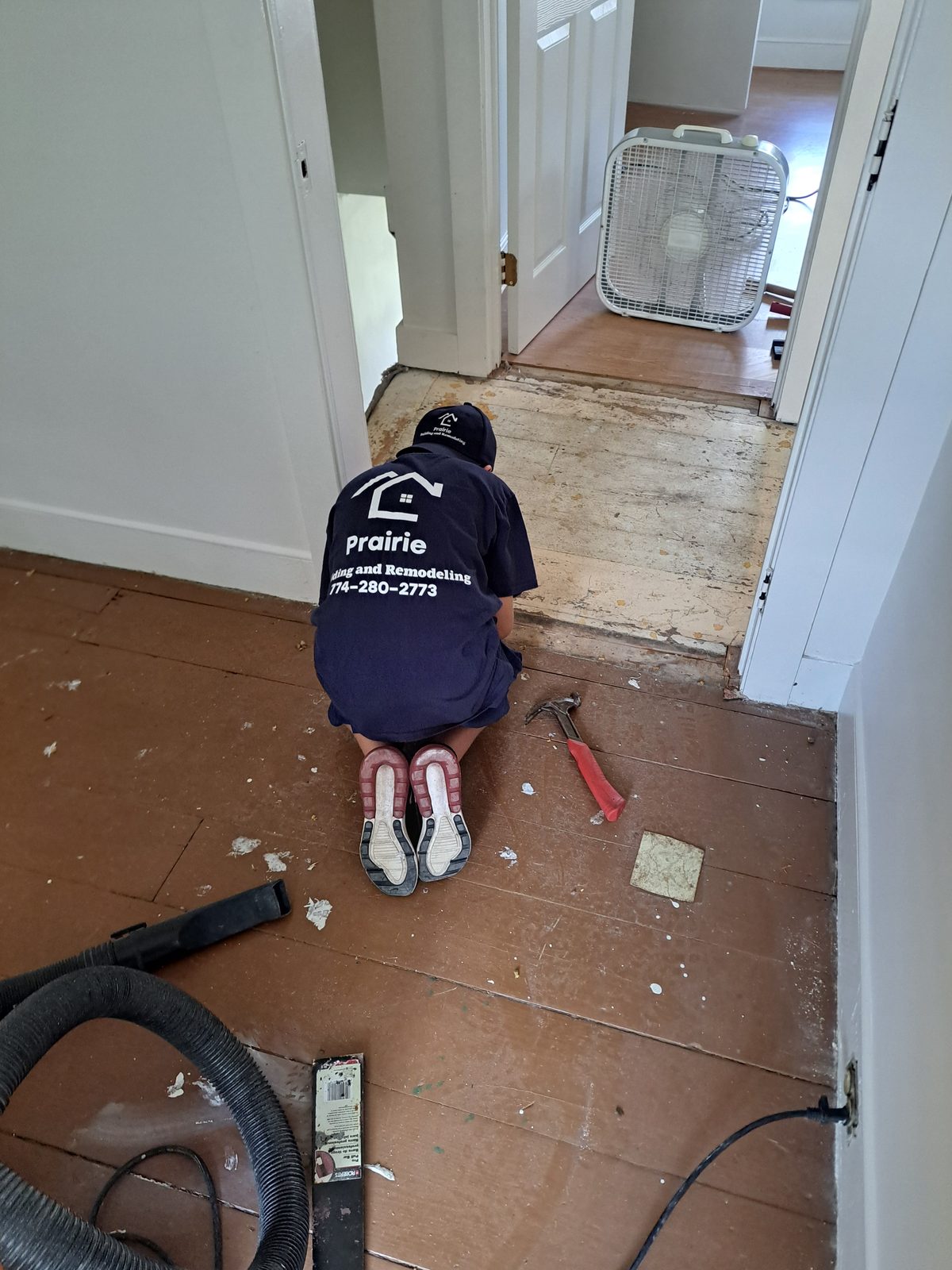 Before — Prairie Building crew removing flooring during a Sutton, MA remodel Before — Prairie Building crew removing flooring during a Sutton, MA remodel