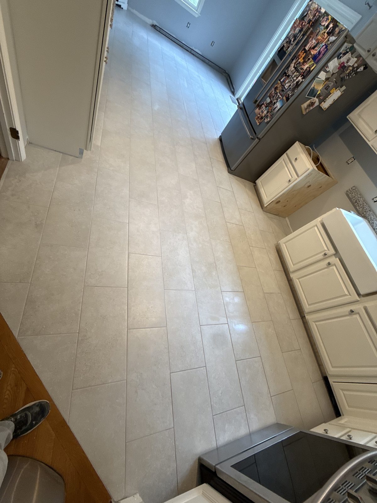 After — tile flooring through a Sutton, MA kitchen After — tile flooring through a Sutton, MA kitchen