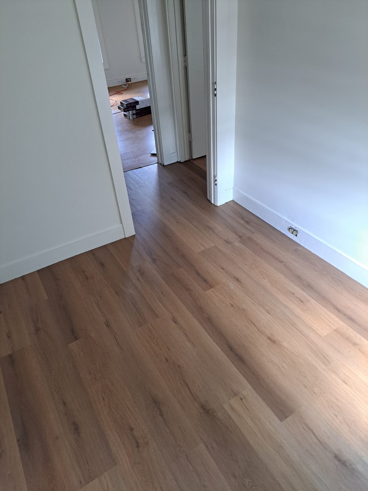 After — plank flooring through a hallway by general contractor Sutton, MA After — plank flooring through a hallway by general contractor Sutton, MA
