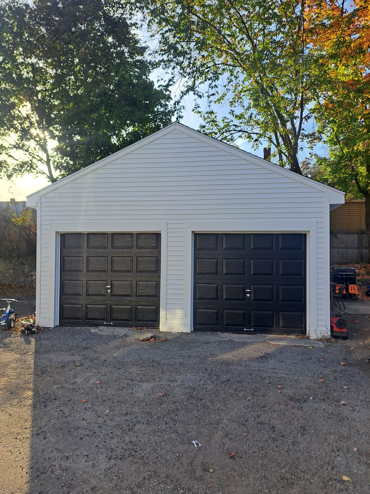After — finished two-car garage with black doors in Sutton, MA After — finished two-car garage with black doors in Sutton, MA