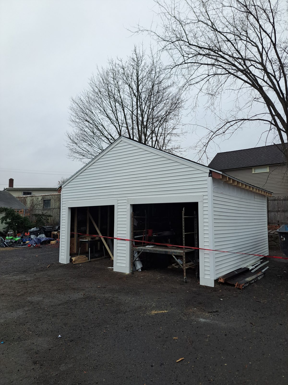 After — new white siding on a two-car garage in Sutton, MA After — new white siding on a two-car garage in Sutton, MA