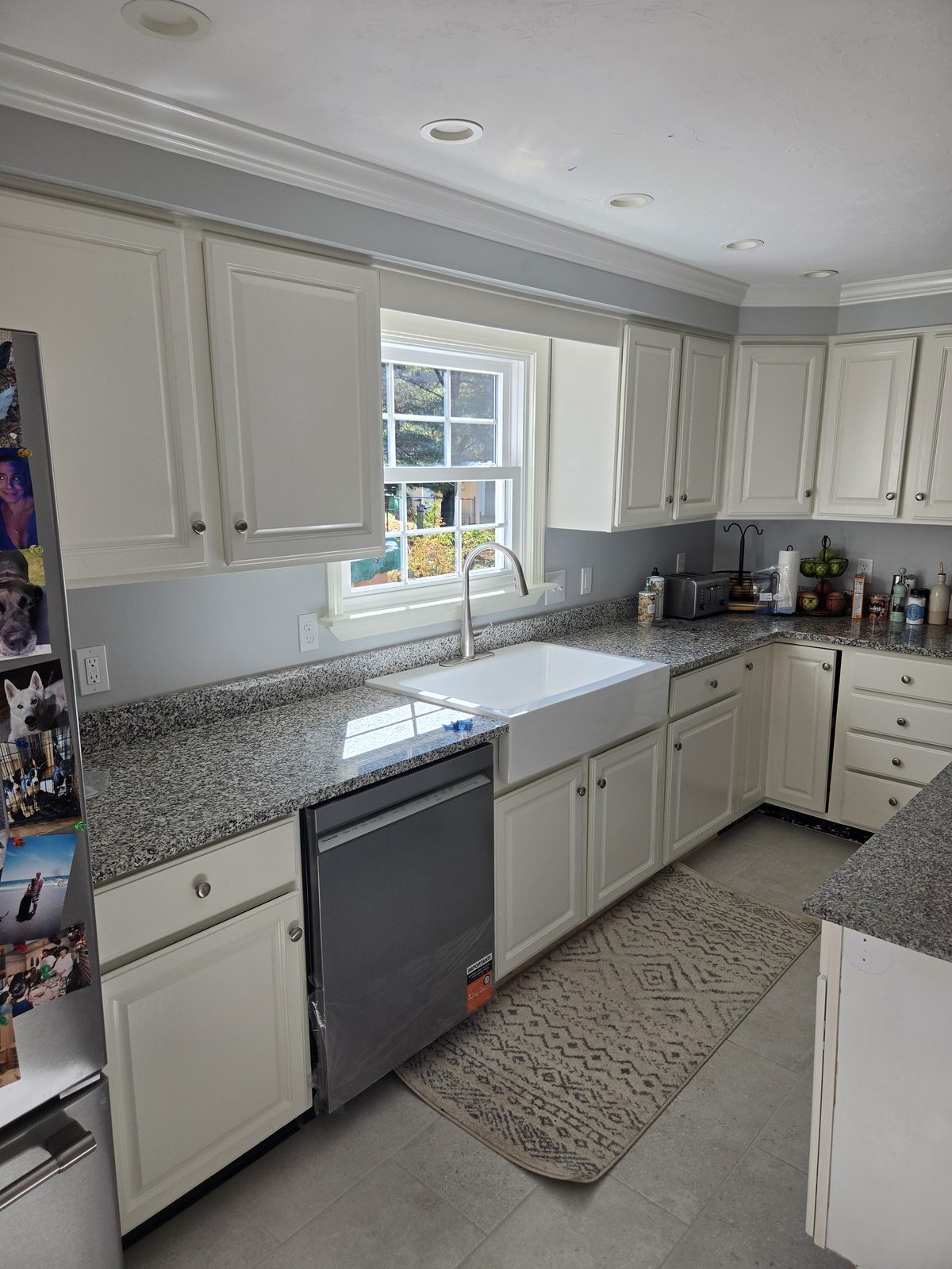 After — dishwasher, farmhouse sink, and granite counters in a Sutton, MA kitchen After — dishwasher, farmhouse sink, and granite counters in a Sutton, MA kitchen