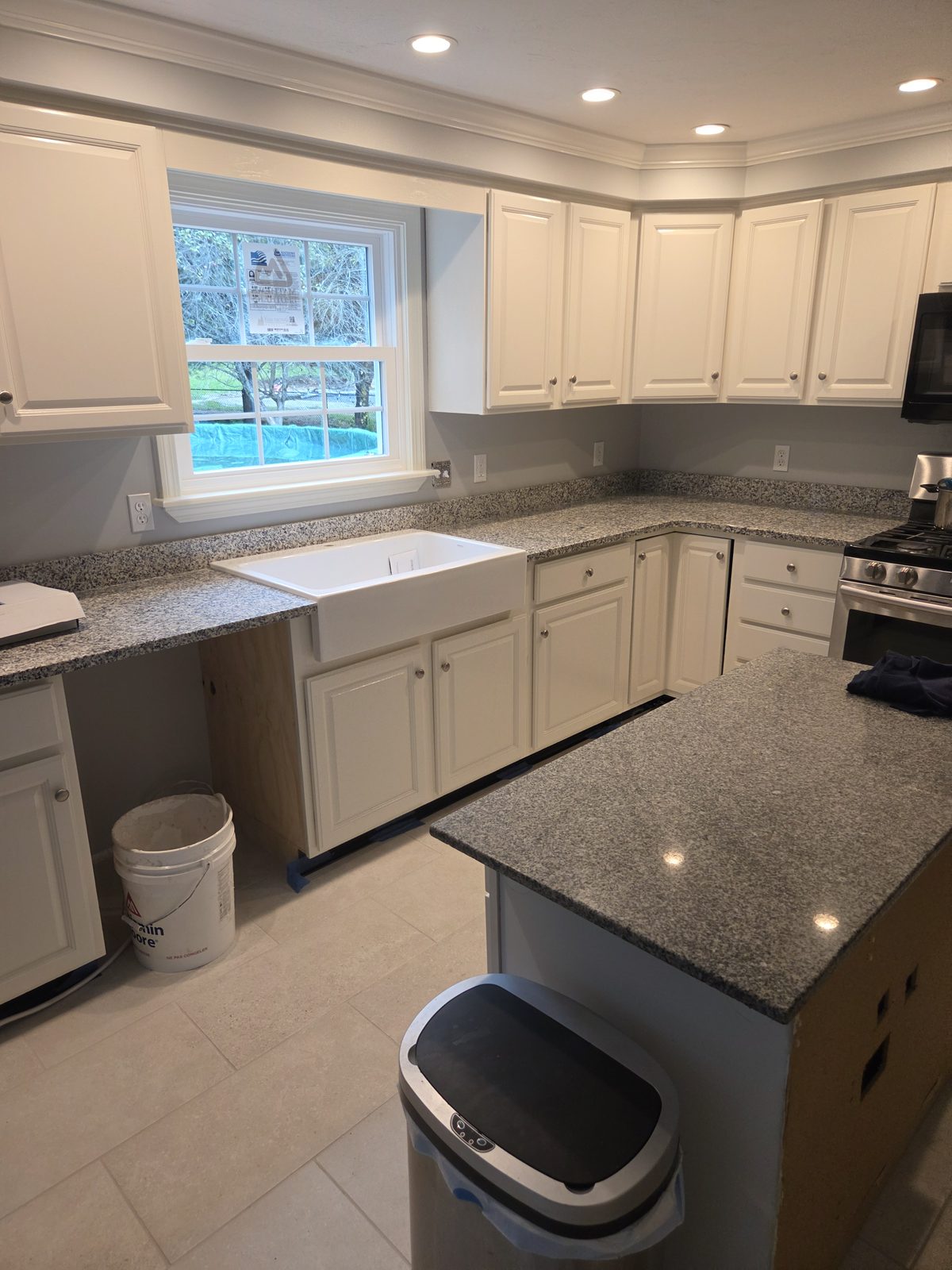 After — white cabinets, granite counters, and a farmhouse sink in a Sutton, MA kitchen After — white cabinets, granite counters, and a farmhouse sink in a Sutton, MA kitchen