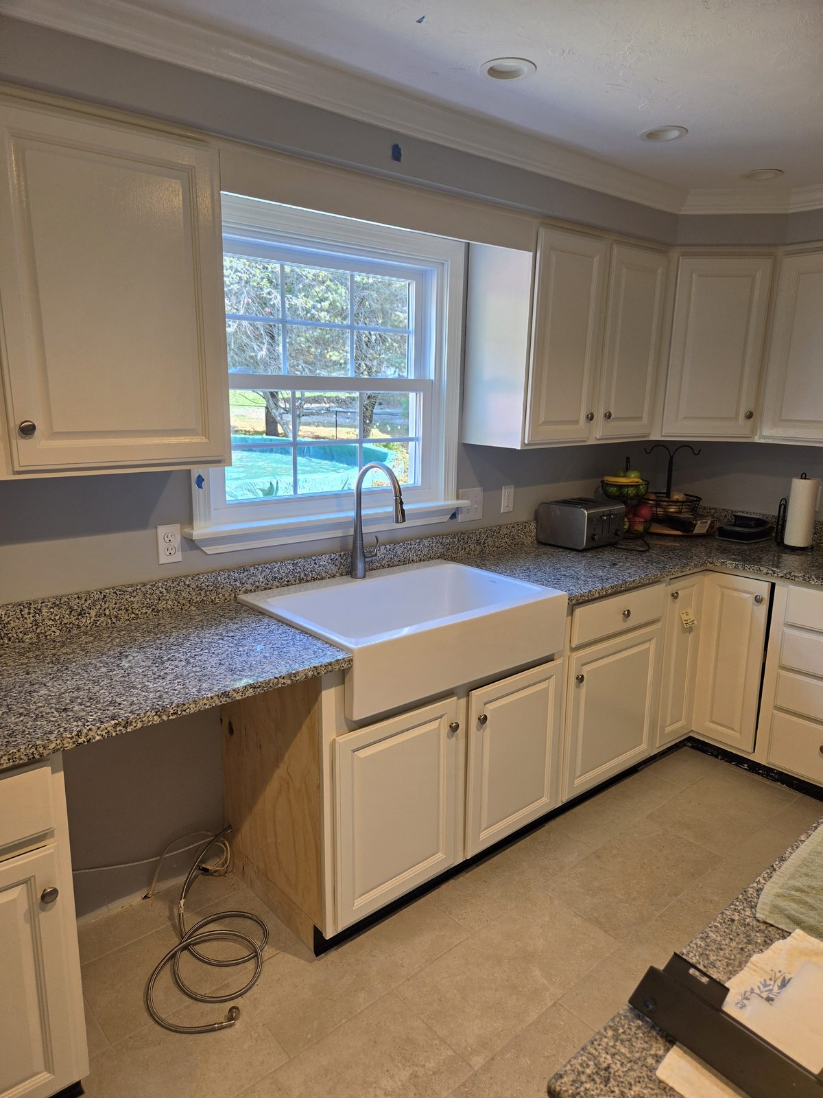 After — farmhouse sink and granite counters in a Sutton, MA kitchen remodel After — farmhouse sink and granite counters in a Sutton, MA kitchen remodel