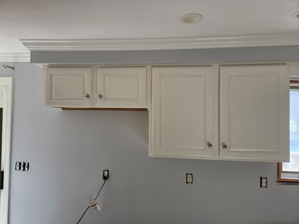 After — white upper kitchen cabinets in a Sutton, MA kitchen remodel After — white upper kitchen cabinets in a Sutton, MA kitchen remodel