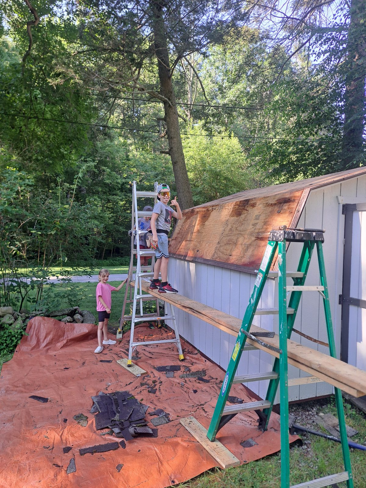 Before — shed shingle removal during roofing in Sutton, MA Before — shed shingle removal during roofing in Sutton, MA
