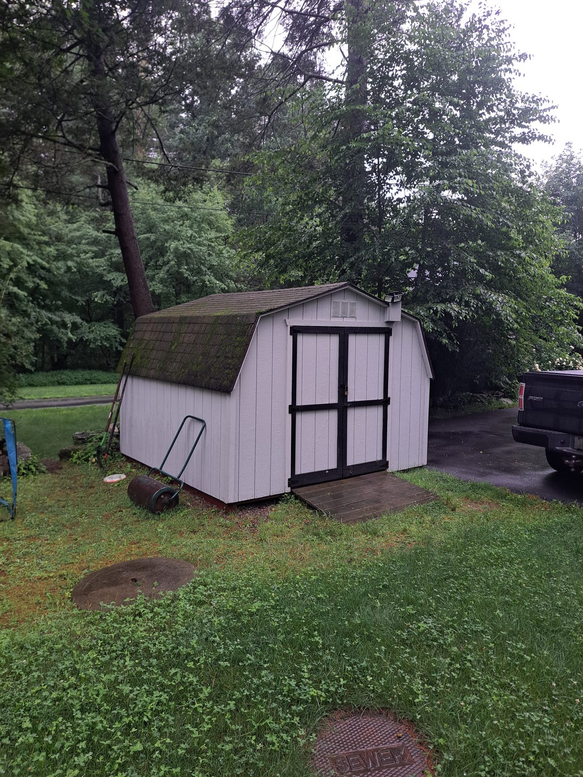 Before — shed roof shingles prior to reroofing in Sutton, MA Before — shed roof shingles prior to reroofing in Sutton, MA