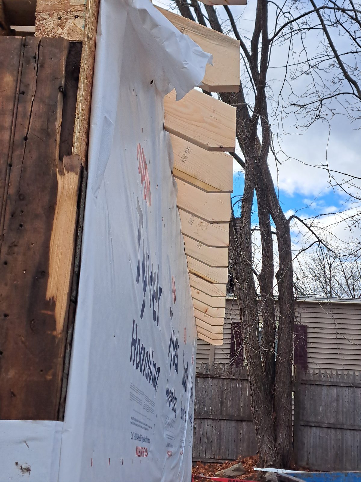 Before — house wrap and rafter tails during garage remodeling in Sutton, MA Before — house wrap and rafter tails during garage remodeling in Sutton, MA