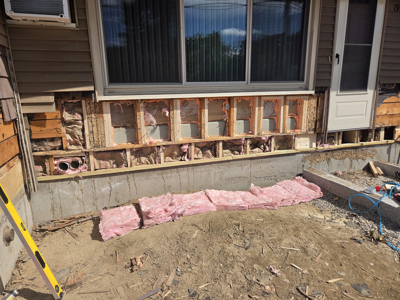 Before — stud bays and insulation during exterior wall repair in Sutton, MA Before — stud bays and insulation during exterior wall repair in Sutton, MA